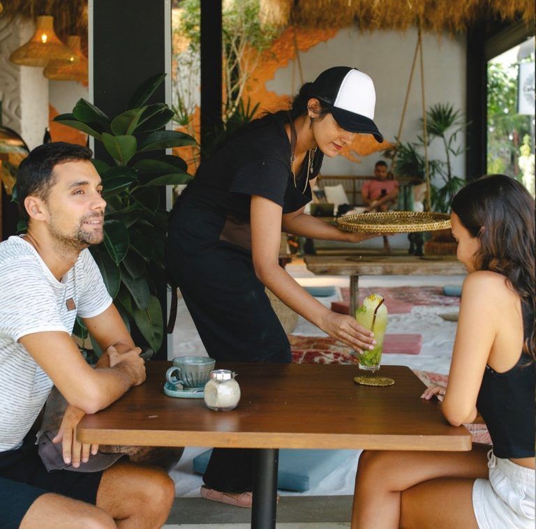 Guests Being Served Drinks at 98 Acres Resort and Spa
